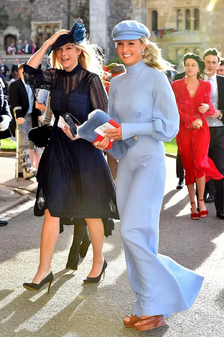 Prince Harry's ex-girlfriend Chelsy Davy (left) arriving in a navy-and-black lace gown.