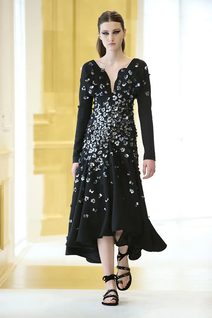 Black wool crêpe dress embroidered with sequins and iridescent and black beads.  Photo: Dior