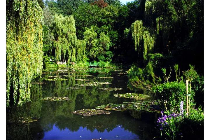 Claude Monet created some of his most iconic work in the gardens of the home he rented in Giverny, a French village 50 miles north of Paris. You can even walk across the famed Japanese footbridge he painted 18 times in 1899. Photo: GEtty