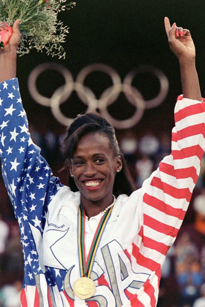 U.S. heptathlon athlete Jackie Joyner-Kersee is all smiles when she celebrates her gold medal at the Barcelona games. Photo: Getty

