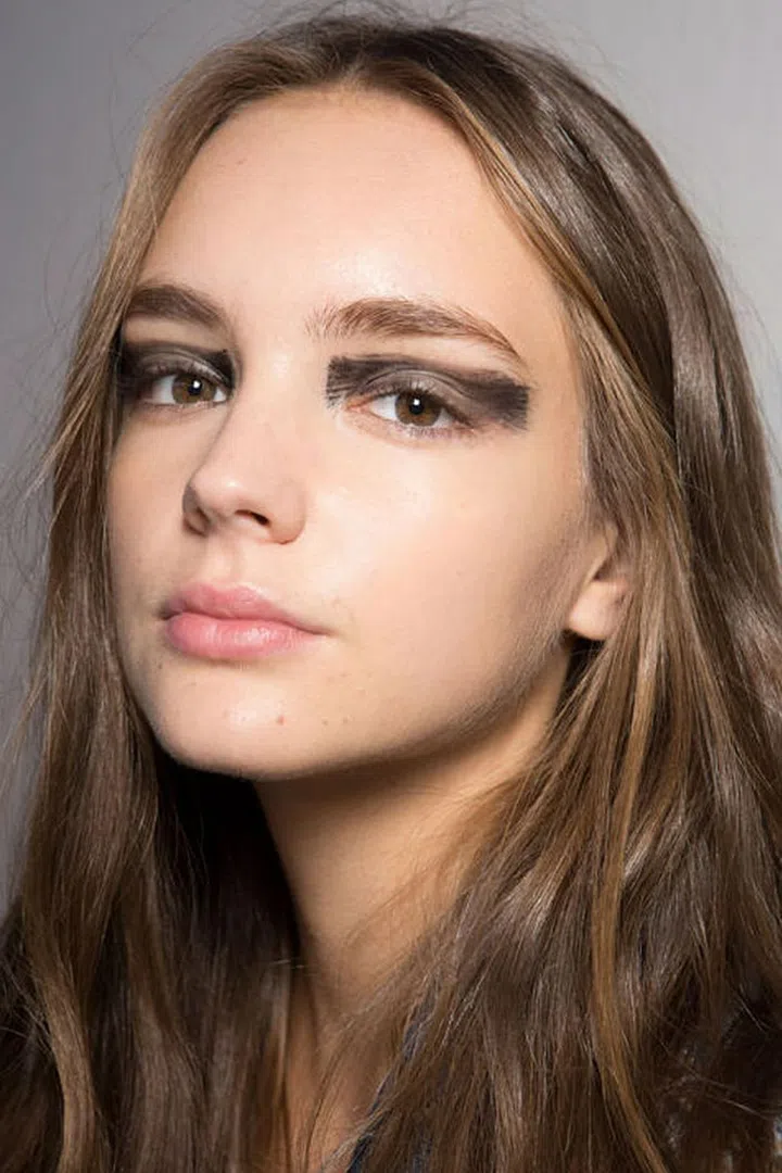 At Pucci, black eyeshadow was haphazardly swept across the lids.