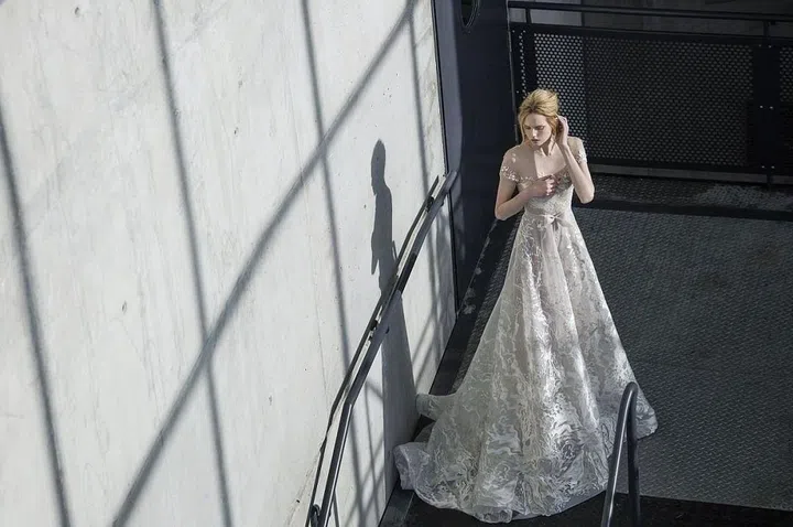 After proving themselves for the past six seasons in the U.S. (they were mainstays in Israel for years before landing stateside), Tel Aviv-based mother-daughter duo Mira and Lihi Zwillinger are well on their way to cementing their point of view on the American bridal market. Known for their incredibly delicate appliqués, second-skin illusion net necklines and weightless volume, this family-run atelier uses soft color (think barely-there nude and soft, cloudy greys) and the highest quality fabrics to create silhouettes for any occasion. If you are seeking a romantic style with a European sensibility, their website should be in your bookmarks.