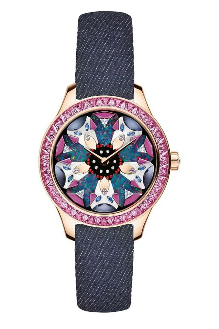 A kaleidoscopic look at the embroidery from Christian Dior haute couture provides the inspiration for the one-of-a-kind Dior Grand Soir Kaleidiorscope No.3. The pink gold automatic watch mixes pink sapphires, diamonds, opals, mother-of-pearl, and onyx in a multicolored dial. Even though haute couture might be considered a dying art, the unexpected and witty use of denim for the strap sets the watch apart as a contemporary part of the Dior fashion lexicon.
Christian Dior, Dior Grand Soir Kaleidiorscope No.3. from Dior Timepieces. One-of-a-Kind Piece, Price Upon Request. Available through select Dior boutiques, 1-800-929-DIOR or dior.com