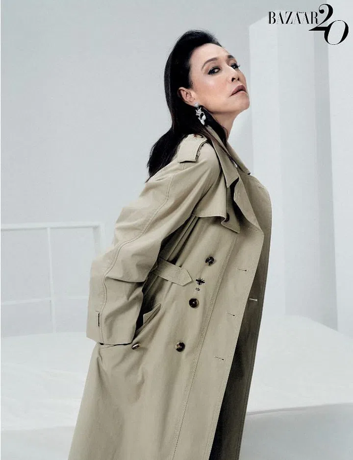 Coat, Dior. Earring, Roger Vivier.
