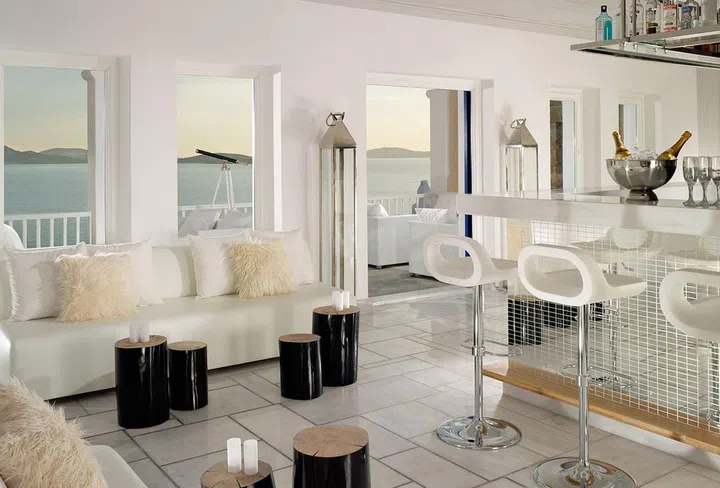 Every year, designers, musicians, and models flock to the whitewashed wonderland of Mykonos. The Greek island is known for its azure-blue seas, incredible Cycladic architecture, and amazing beach clubs, like Nammos and Scoprios, where the likes of Leonardo DiCaprio, Mariah Carey, Hugh Jackman and Alessandra Ambrosio have been spotted.

Mykonos Grand is considered one of the most beautiful boutique resorts on the island, with a private beach, lavish rooms and one of the coolest cocktail bars to watch the sunset. Superstar actor Benedict Cumberbatch has been spotted here along with a slew of musicians, models, and moguls.