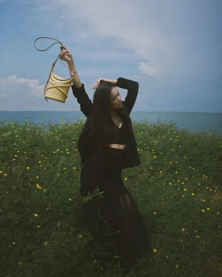 Yoyo Cao carrying The Curve bag. Photo: Courtesy