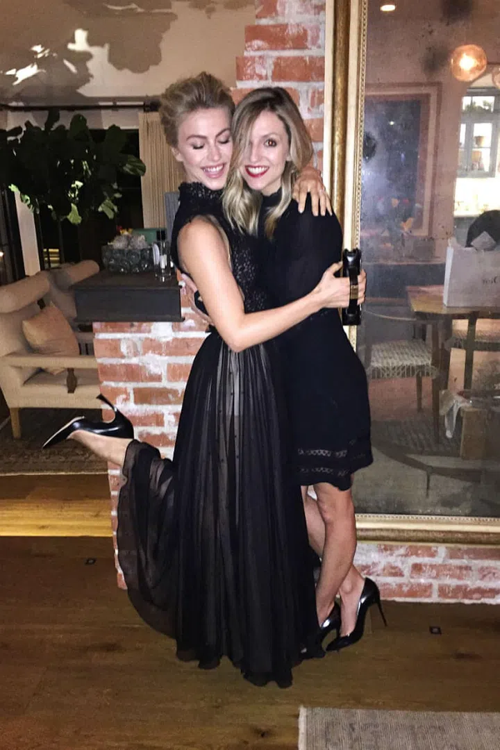 Hough giving her friend Maude Hirst a hug before heading out the door. 
