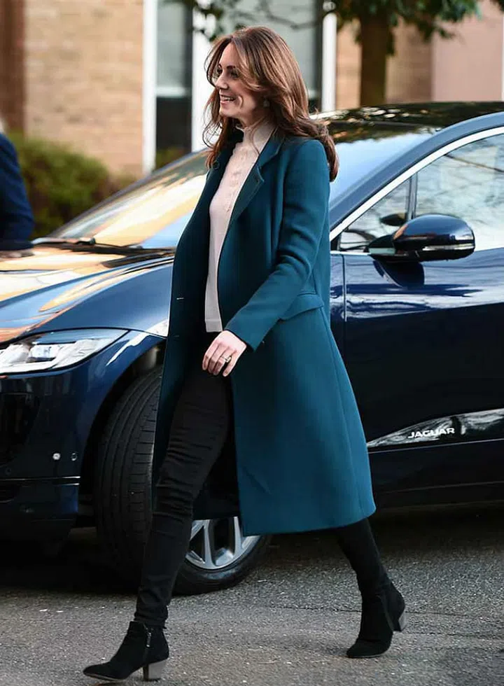 The duchess made an official appearance at Stockwell Gardens Nursery and Pre-school, where she learnt about childhood development and nutrition and served breakfast to the children. She wore a smart teal coat, a Sézane merino wool pullover, skinny black jeans and Chelsea boots from Russell & Bromley.