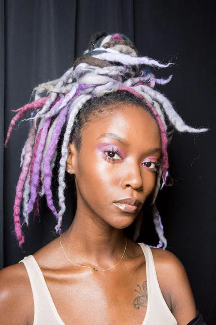 Glossy lips and shimmery purple eyes backstage at Marc Jacobs.