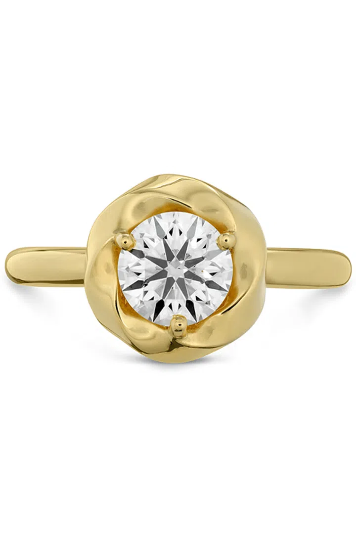Your ring has: A bezel setting

You are: No fuss, no muss. "You're the ultimate minimalist," Sabatino says. "You want something that lasts through all the trends and fads." You appreciate fine craftsmanship and covet a ring that will last a lifetime.

Hearts on Fire Atlantico Wave Halo Solitaire Engagement Ring, heartsonfire.com.

Photo: COURTESY OF HEARTS ON FIRE