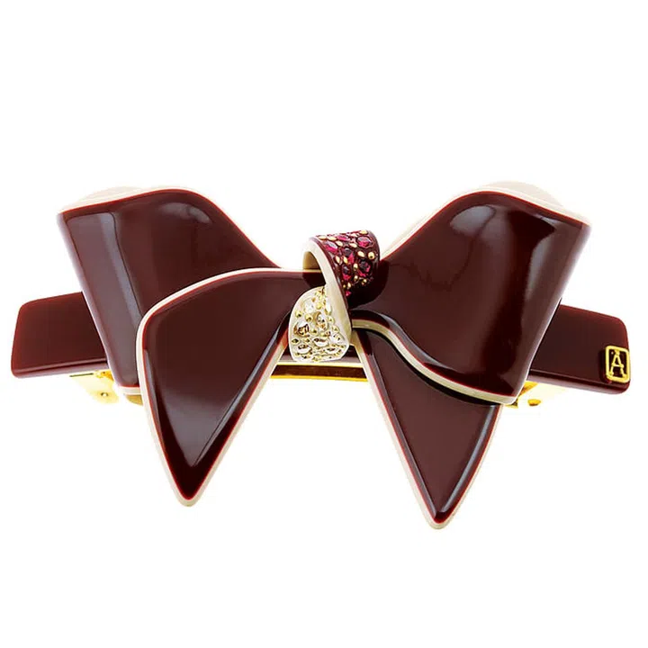 From bedazzled bows to modern tiaras, a well-placed accessory gives an unexpected upgrade to the simplest of hairstyles. Take a cue from the runways and get a-clipping.