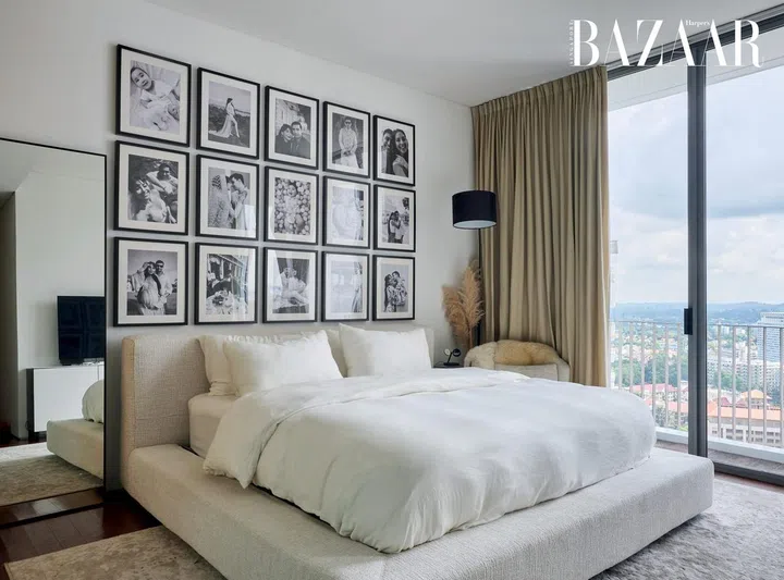 The master bedroom is a monochromatic oasis of calm overlooking the cityscape. 