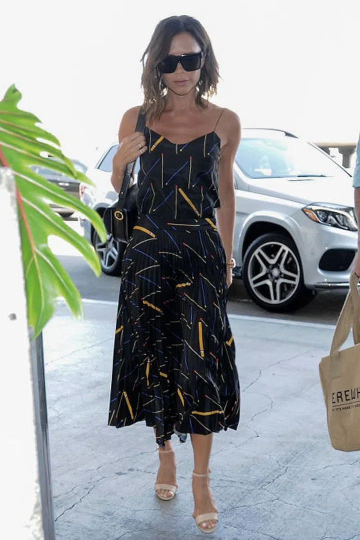 Beckham's personal style evolution – ie a move from fitted silhouettes to more fluid, loose shapes – has filtered down to her fashion collections. A midi-length slip dress is a favourite of hers, to be worn with a polo neck for cooler evenings.