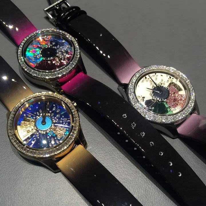 Above the dial of the Grand Bal Piece Unique Galaxie watch is a thin, clear sapphire crystal plate  (embedded with gems) that rotates 