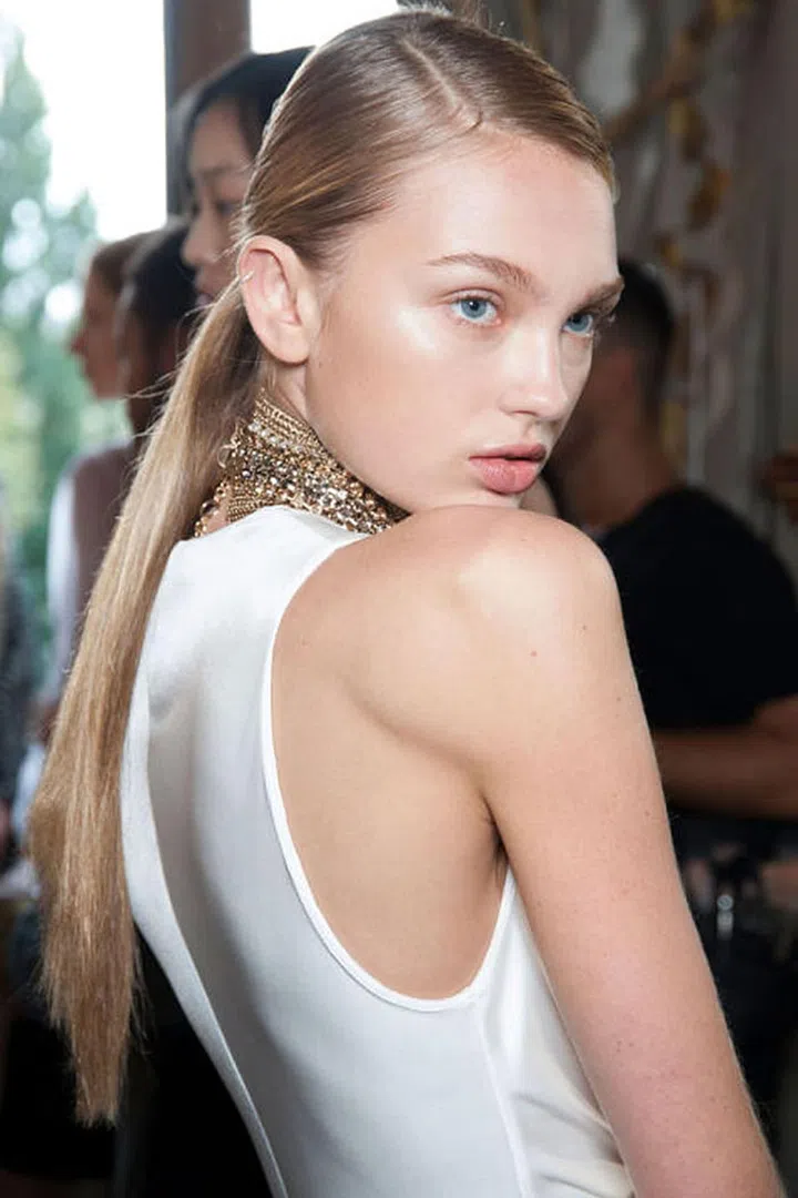 The only thing  more striking than the deep side parts at Lanvin was the intense cheekbone highlight.