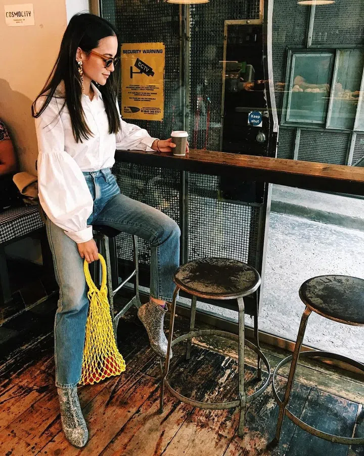 Bazaar's very own Anna Vitiello has already been spotted carrying the colourful string bag from H&M's new Conscious Collection.