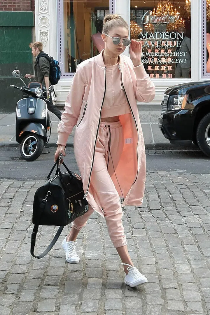 Hadid looked spring ready as she stepped out in pink athleisure separates and metallic aviators. Photo: Splash