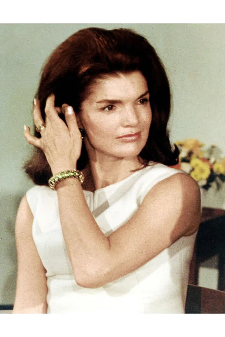Jacqueline Onassis wearing a lapis lazuli bracelet.