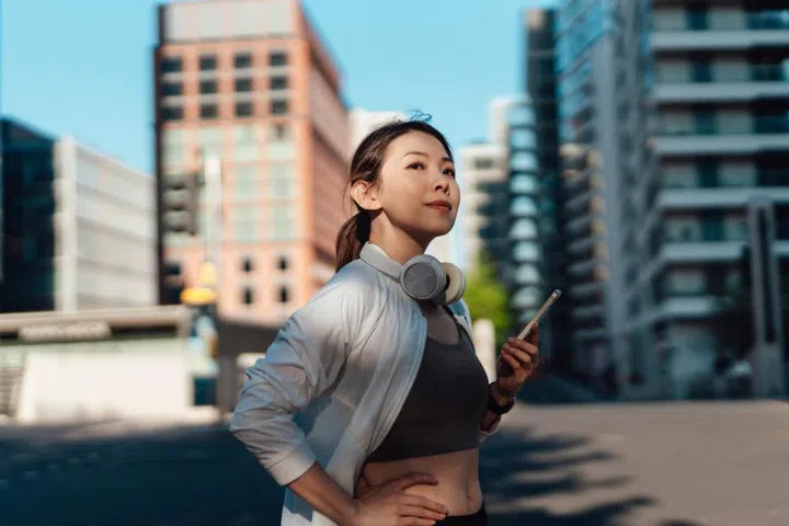 Young women checking phone while outdoors