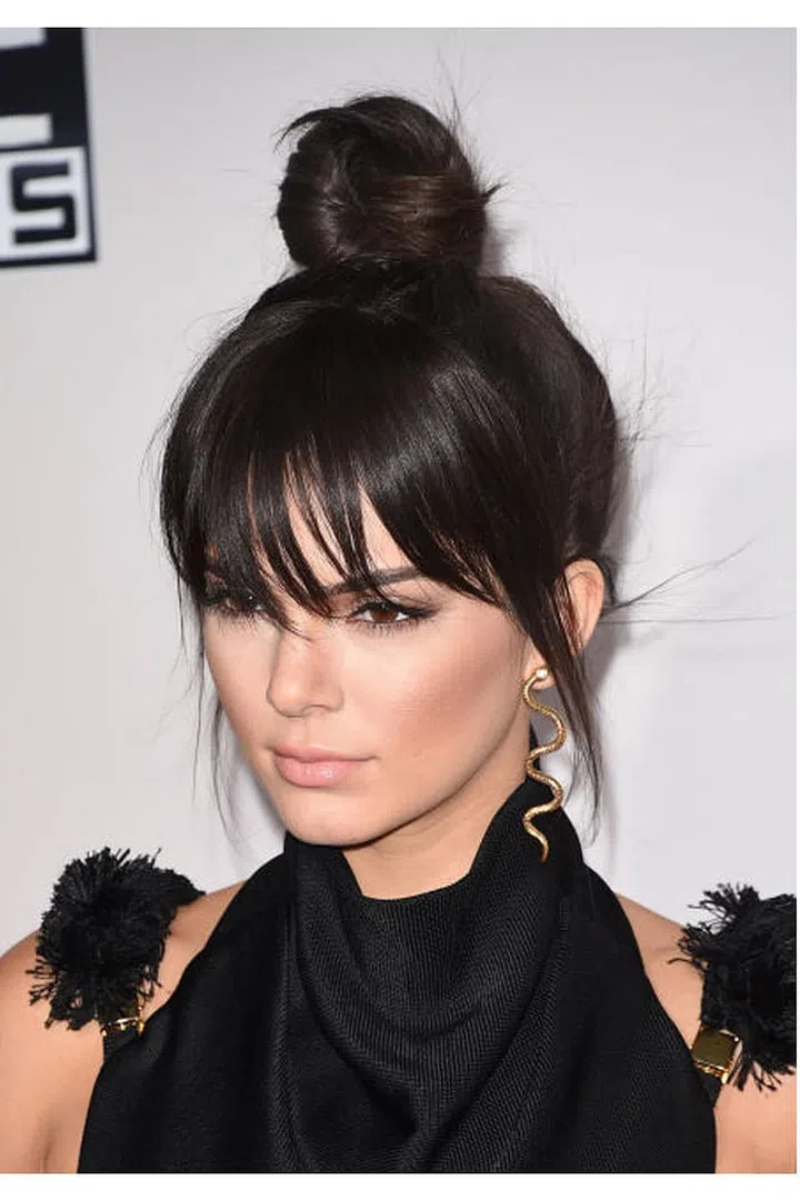 Kendall Jenner showed up with a long fringe at the 2015 AMAs, but spoiler alert: it was a clip-in. "People have asked me to get bangs and I say, 'no way,'" the model explained on her site. "Thankfully, faux-fringe is always a good solution."