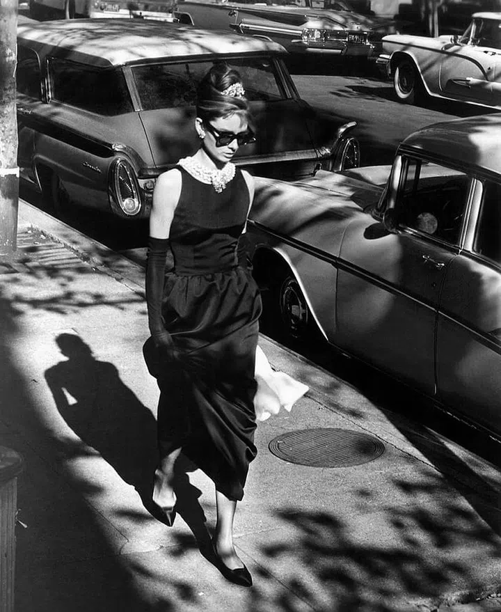 Hepburn in the famous little black dress designed by Givenchy, worn during the opening credits of Breakfast at Tiffany's.