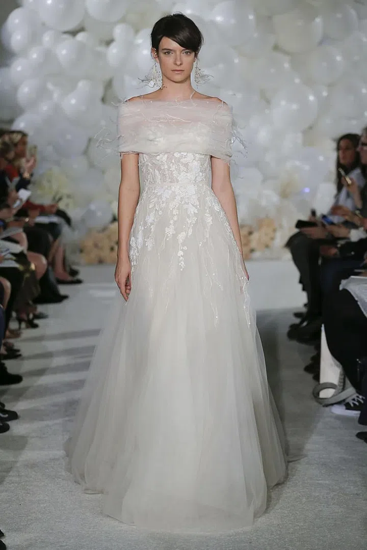 A shawl neckline, rather than a straight up strapless , offers up coverage witout feeling as trendy as off-the-shoulder bodice. Mira Zwillinger gown, mirazwillinger.com. 