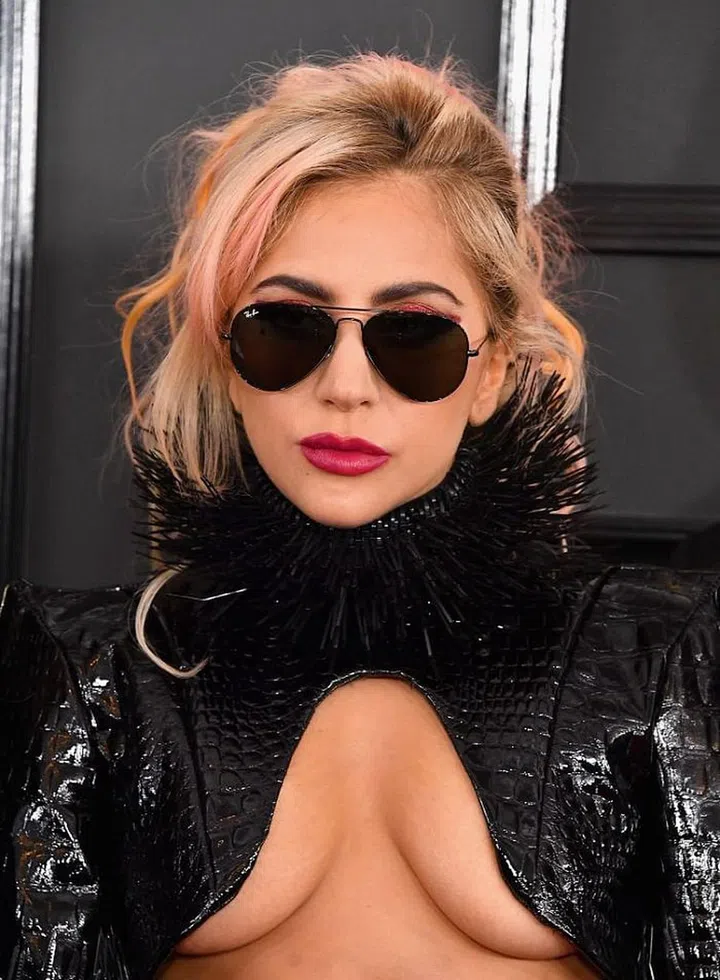 OTT as her outfit might be, it still didn't distract us from that perfect shade of amaranth lipstick.  

Photo: Getty Images