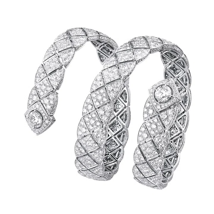 Ask any woman about the first three Chanel hallmarks that pop into her head and chances are, they’ll be:  Tweed, pearls and the quilt, thanks to the house’s  beloved 2.55 bag. The 48-piece Signature de CHANEL
collection pays tribute to the latter. Featuring a total of 1,180 diamonds (for a whopping 28.6 carats), this graphic multi-coil bangle is a guaranteed showstopper that will turn heads.
