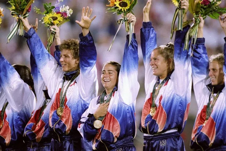 The U.S. women's soccer team rocking tie-dye jerseys while they celebrate a win over China at the games in Georgia. Photo: Getty