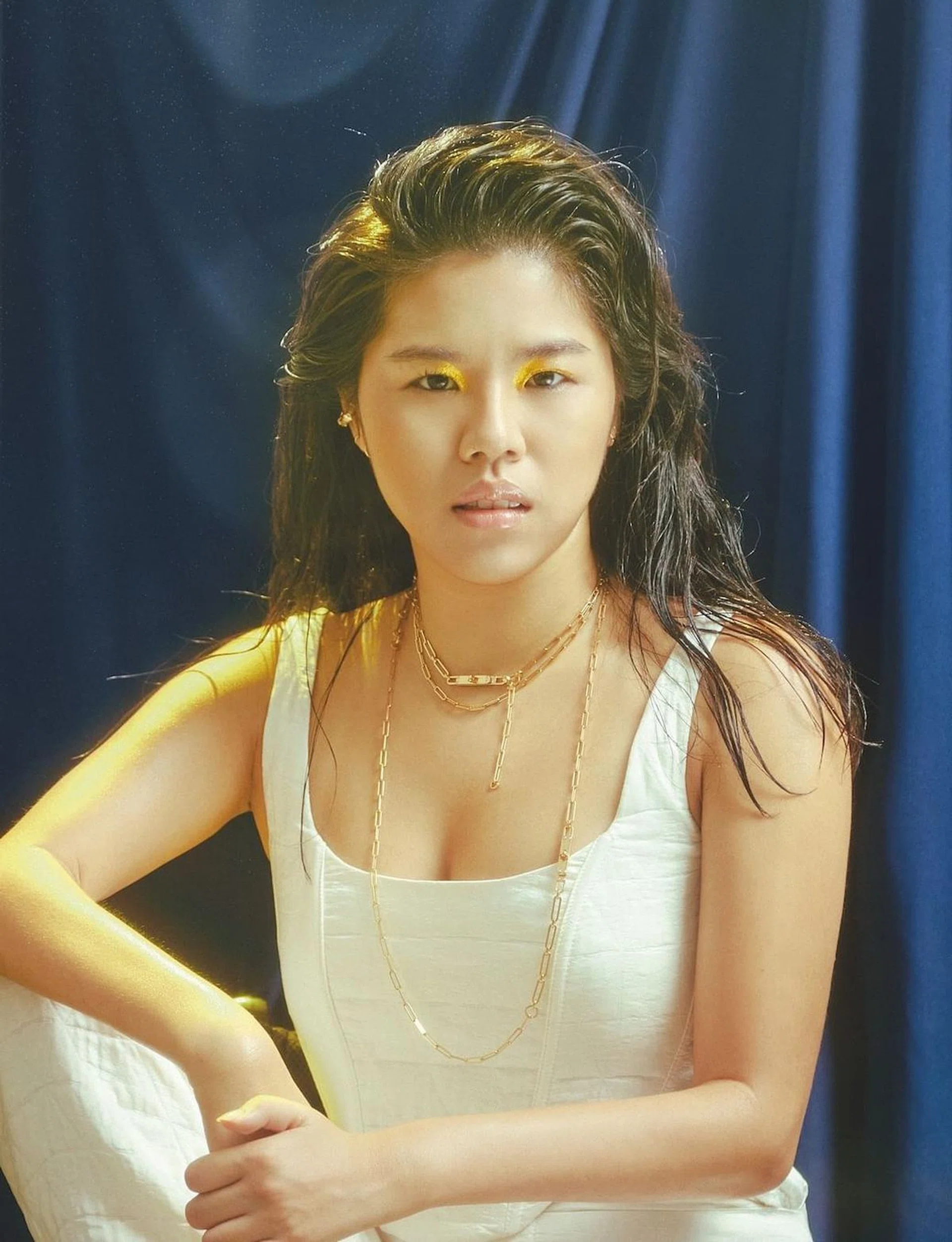 Top and trousers, both from H&M. Ear cuff, from Swarovski. Necklaces, from Hermès. (Photo: Jayden Tan)