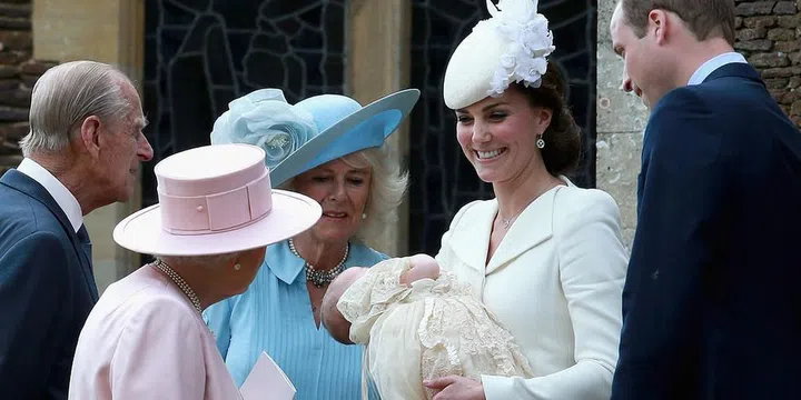 Queen Elizabeth greets the Duchess of Cambridge and Prince William at the Church of St. Mary Magdalene aftert the christening of Princess Charlotte. Photo: Getty