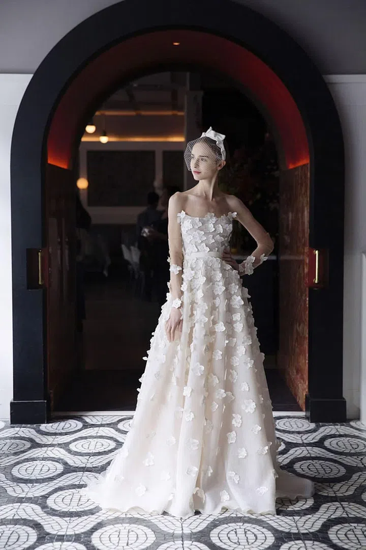 Three- dimensional appliqués that hearken to your natural setting make any A-line shape the ultimate look for your rural nuptials. Lela Rose "The Primrose Hill" gown, lelarose.com. 