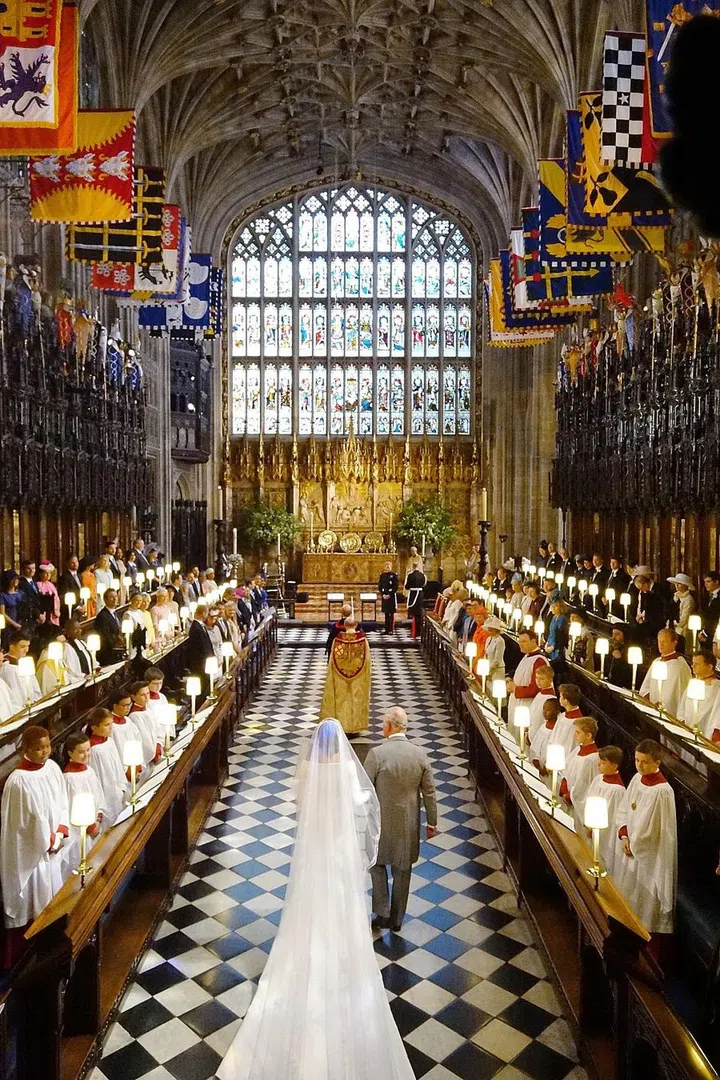 Prince Charles, Prince of Wales leads Meghan Markle up the aisle 