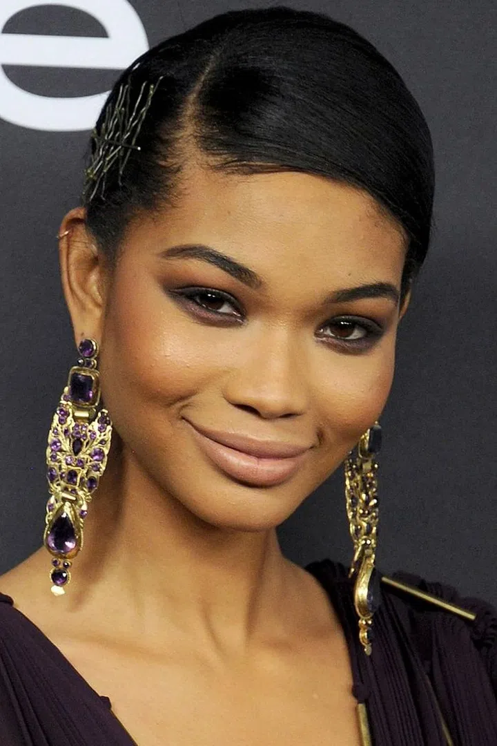 The hazy purple eyes are good, but the pile of bobby pins scattered across the side of her head is great.