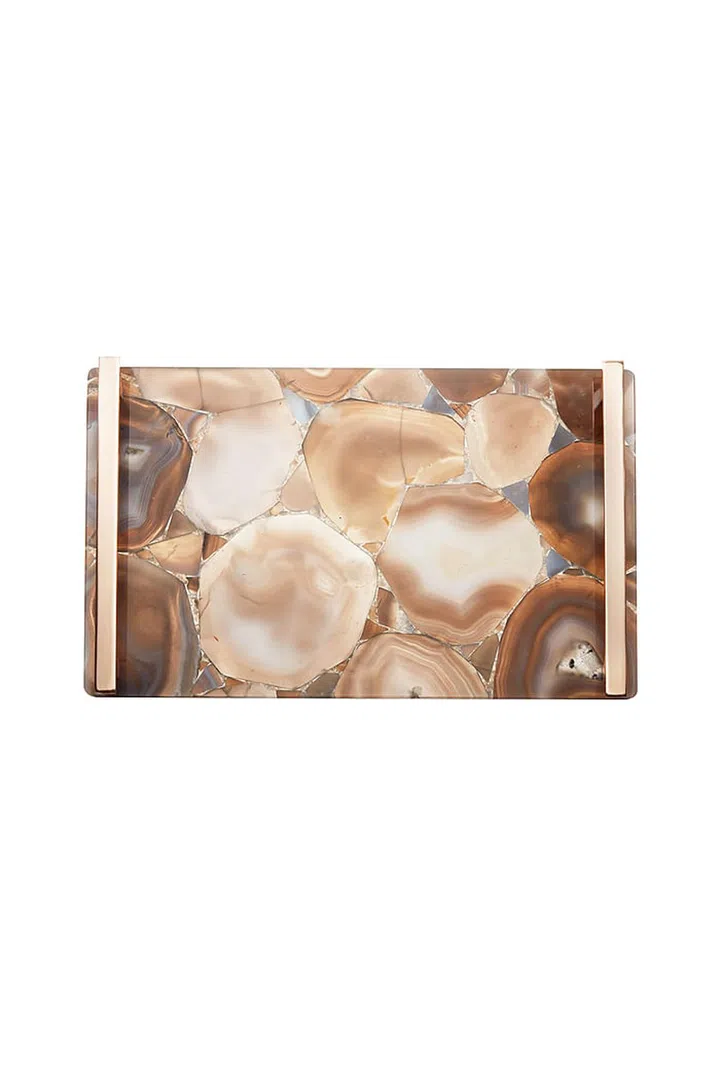 Think of your furniture as you do your clothing—more layers make things interesting and adds texture. Place this tray on your coffee table or bookcase for some extra oooh. 

Kendra Scott Stone Tray, $495; kendrascott.com