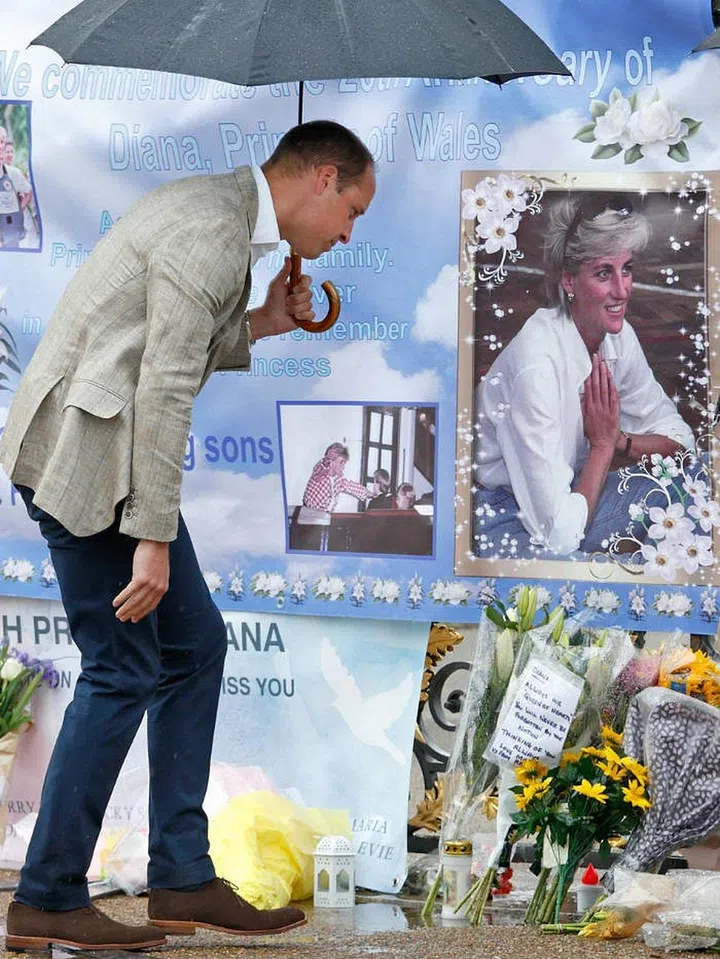 Prince William views tributes to the late Princess Diana left at the gates of Kensington Palace in honor of the 20th anniversary of the royal's tragic death.
