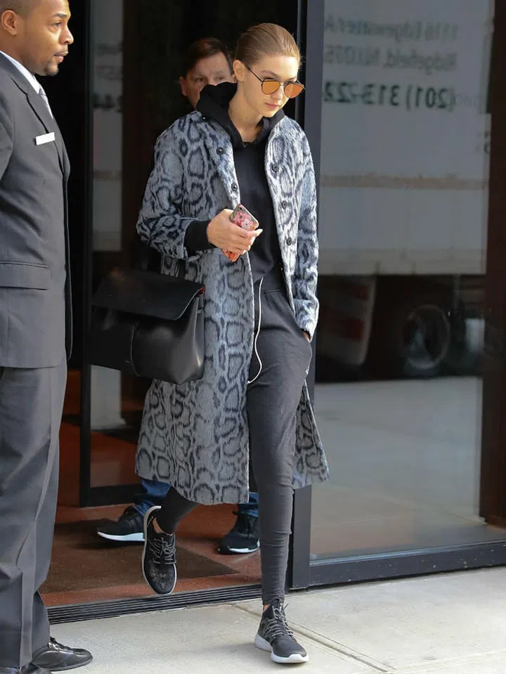 Cleverly layered under a sophisticated oversized coat (Photo: Getty)