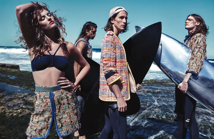 (From left) Tweed skirt; tweed vest; tweed cap; tweed jacket; tweed jacket. Lycra bikini top, Eres. Gold Diva necklace, Bulgari. Wetsuits (worn throughout), NCHE. Surfboards (carried throughout), Haydenshapes.