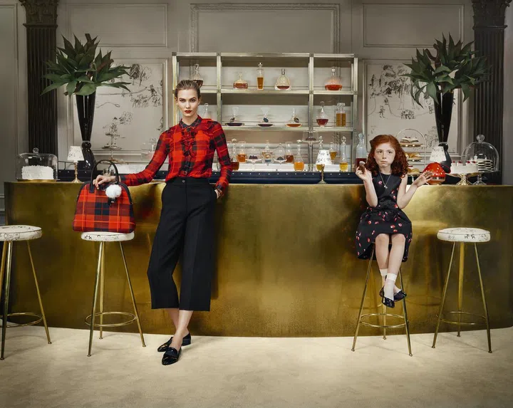 Karlie Kloss with one half of the Marold sisters 