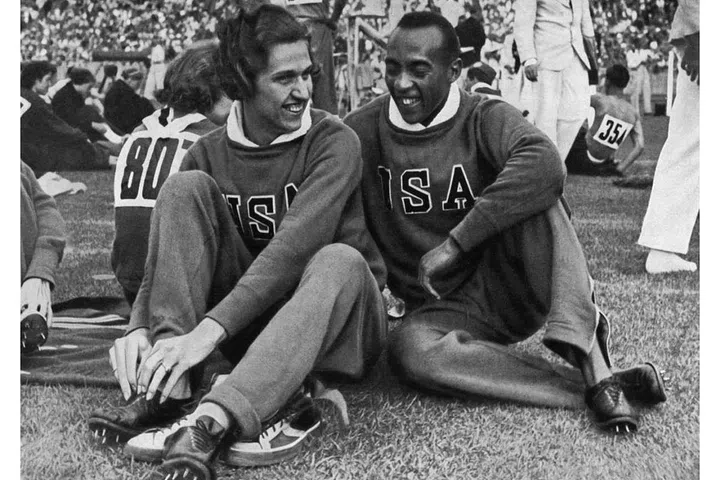 Jesse Owens and Helen Stephens, another American runner who won two gold medals that year, at the stadium in Berlin. Photo: Getty