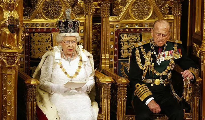 Queen Elizabeth II and Prince Philip right before the Queen's speech at the State Opening of Parliament—the official start of the parliamentary year.
