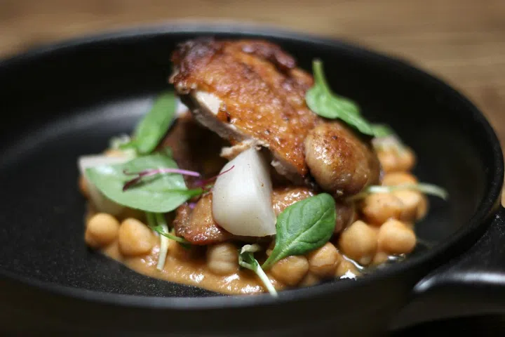 Pan-seared crispy quail served with pickled
turnips, a nutty chickpea casserole and banana
shallots

Photo: Courtesy of Open Door Policy