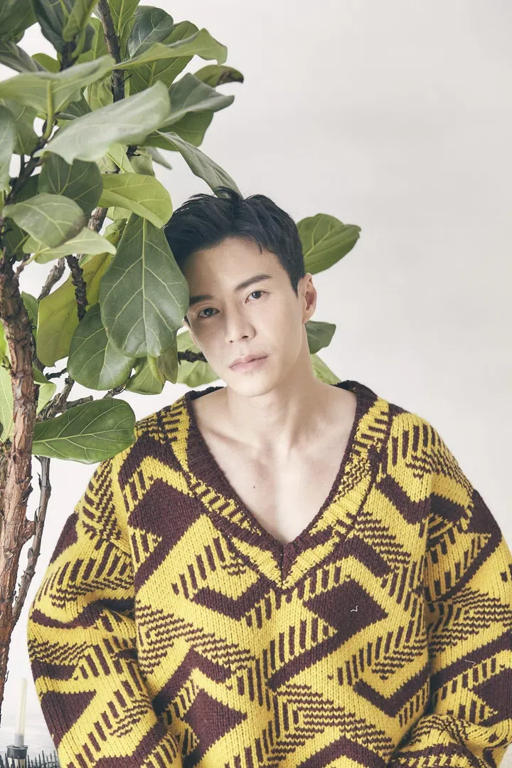 Wong, in a Prada sweater, with the ficus tree he brought over from his previous residence. Photo: Veronica Tay.