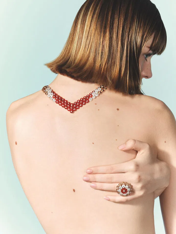 Rose gold, diamond, carnelian and mother-of-pearl Bouton d’or necklace, $145,000; rose gold, diamond, carnelian and mother-of-pearl Bouton d’or ring, $26,800, Van Cleef & Arpels. Photo: Stefan Khoo
