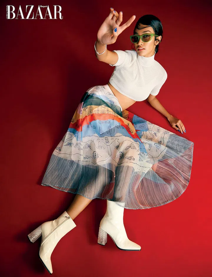 Skirt, from Reckless Ericka. Top, from Fendi. Sunglasses, from Gentle Monster. Bracelet, from Kate Spade New York. Boots, from Jimmy Choo. (Photo: Phyllicia Wang)