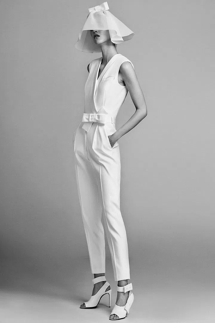 The wedding industry (and bridal salon owners in particular) feel a certain type of deep-seated glee when the news of a heritage brand like Lanvin, a rule-defying label like Vivienne Westwood or a Haute Couturier like Viktor & Rolf (or Elie Saab) is designing a made-to-order collection for the aisle. For Spring 2017, the launch of Viktor & Rolf Mariage wowed us with a 20+ piece range so well-rounded that it seemed a V&R bride would have to look no further, even when on the market for multiple looks. The collection's two jumpsuits were the perfect after-party or rehearsal dinner options and a convertible embroidered gown (a 2-in-1 style that could have fallen prey to looking overwrought and crafty) effortlessly transitioned from an A-line silhouette to a chic mini. Our favorite look? A sweet collared shift dress that would be the perfect mod nod to any civil ceremony.