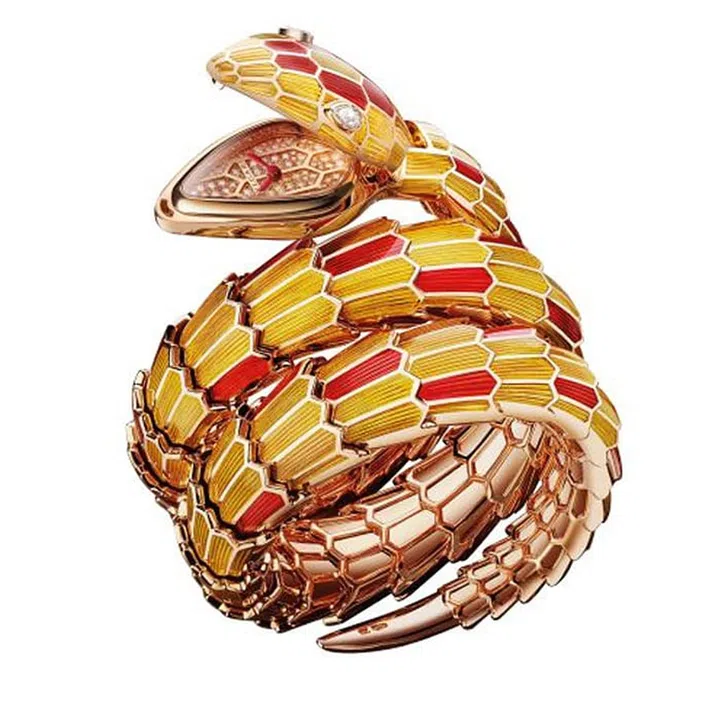 This reptile specimen in pink gold, yellow and red lacquer, with two pear-shaped diamond eyes  is the legendary Serpenti from Bulgari. The timepiece is hidden discretely inside the mouth of the snake; the pink gold dial features 82 brilliant cut diamonds with red hour and minute hands. 
Price Upon Request. bulgari.com
