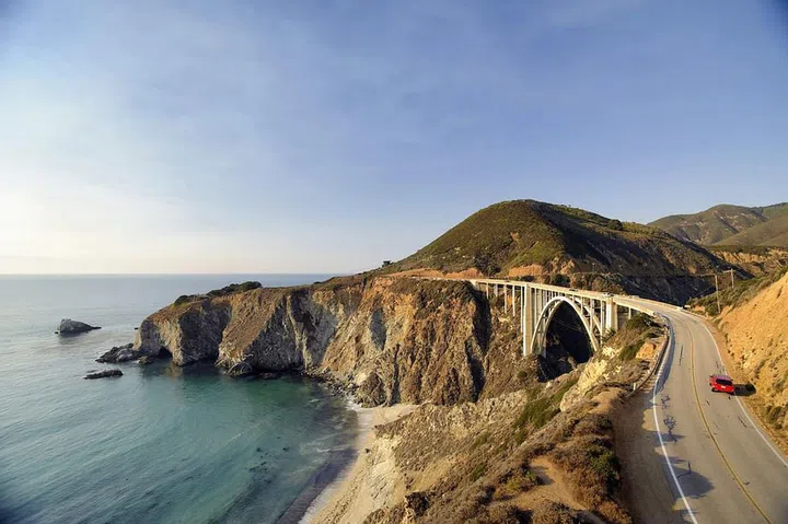 A year after a devastating mudslide, the last closed section of California’s Highway 1 just reopened—and that means road trips up the coast to Big Sur can resume.

Ventana Big Sur took advantage of the forced downtime and revamped and rebranded as an Alila Resort, now with super-romantic glamping tents (think plush mattresses and a bath house with heated floors and marble vanities) set right among the redwood trees. There’s also a new spa that offers a two-hour “herbal bliss” treatment just for couples. The best days begin with any of the baked goods from Big Sur Bakery—the perfect fuel for a hike at Point Lobos State Natural Preserve or Pfeiffer Big Sur State Park. (We recommend going back for one of their wood-fired pizzas.)
Photo: Getty