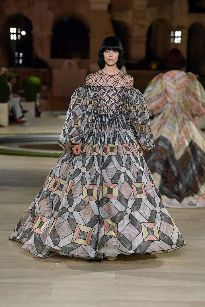 Silvia Venturini Fendi is another designer tasked with moving a legacy house forward in the wake of Karl Lagerfeld’s passing and she has done it with respect— not by mining his vast archives, but by channelling the duality of his creative spirit. Lagerfeld was always enchanted by the past, yet he constantly sought out the new and the extraordinary. For this couture spectacular staged al fresco in an ancient Roman temple, the artistry she teased out of the Fendi fur ateliers were extraordinary indeed. They took as inspiration the ancient mosaics and marbles from the fl oors of grand Roman villas, and translated them into graphic Art Deco motifs. What looked like prints were actually highly elaborate intarsia; fur strips were woven every which way, sheared to look like feathers, threaded between gauze, or bonded with the lightest tulle. The clothes these techniques were employed on had a ’70s fl avour, with fl ared trousers, bishop sleeves and high cinched waists aplenty. There was also a dazzling array of fl oor-sweeping reversible coats—under which Venturini Fendi layered bra tops, short shorts and transparent pieces to keep things light and modern. Lagerfeld would have been proud. 

Photo: Courtesy