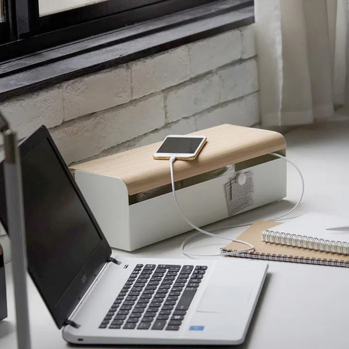 Keep your cords safely and neatly tucked away with this Miyatake Teer Cord Box. It not only keeps your desk organized from unnecessary clutter, but prevents safety hazards with its water resistant and durable steel material. This box ships directly from Japan and is available at hommagelifestyle.com.